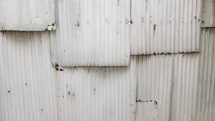 The walls are made of galvanized overlapping, painted white.
