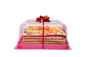multi-colored rainbow cake in a transparent box with a red bow. Celebration cake isolated on a white background.
