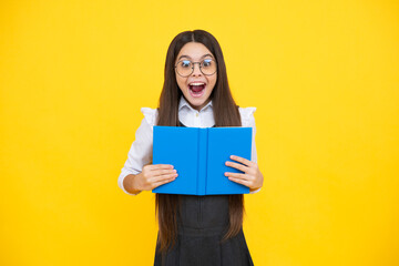 Schoolgirl with copy book posing on isolated background. Literature lesson, grammar school. Intellectual child reader. Excited face, cheerful emotions of teenager girl.