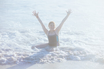 Naklejka premium happy modern teen at beach in beachwear rejoicing