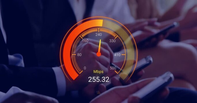 Animation of orange speedometer over hands of diverse businesspeople with electronic devices