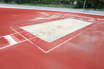 Sand pit for long jump at a sports stadium