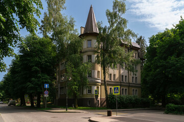 View of an old residential building with a tower on Oktyabrskaya Street on a sunny summer day, Svetlogorsk, Kaliningrad region, Russia