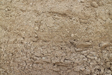 a pile of sand in the summer in the countryside