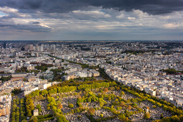 Panorama of Paris city with a cemetery at sunset. France