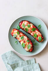 Baked eggplant with cheese mozzarella, tomatoes and basil. Healthy eating. Italian food. Parmigiana di melanzane.