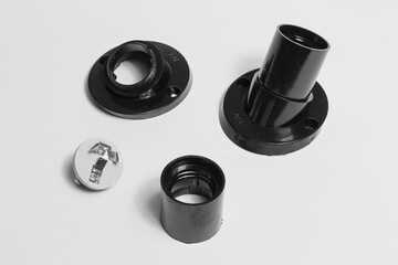 e27 light bulb sockets, one disassembled and one assembled. electrical product