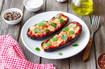 Baked eggplant with cheese mozzarella, tomatoes and basil. Healthy eating. Italian food. Parmigiana di melanzane.