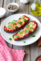 Baked eggplant with cheese mozzarella, tomatoes and basil. Healthy eating. Italian food. Parmigiana di melanzane.