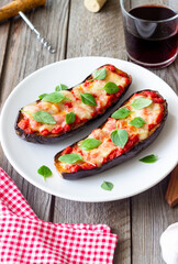 Baked eggplant with cheese mozzarella, tomatoes and basil. Healthy eating. Italian food. Parmigiana di melanzane.