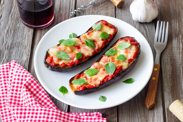 Baked eggplant with cheese mozzarella, tomatoes and basil. Healthy eating. Italian food. Parmigiana di melanzane.