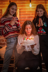 Girlfriends celebrate birthday in a cafe and have fun.