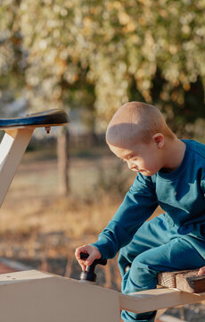 boy with Down syndrome performs a sports task, sports entertainment