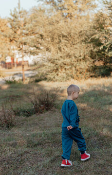 boy with Down syndrome runs walk, a disabled child