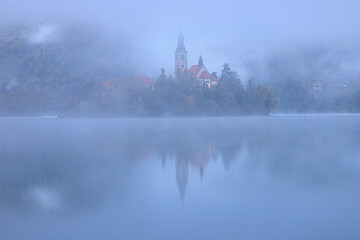 Fototapeta premium Lake Bled, Slovenia at dawn in fog