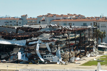 Hurricane Ian destroyed boat station in Florida coastal area. Natural disaster and its consequences