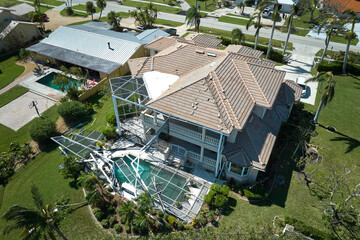 Hurricane Ian destroyed house in Florida residential area. Natural disaster and its consequences