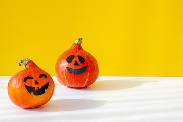 Festive Halloween pumpkin ghosts heads. Halloween greeting card