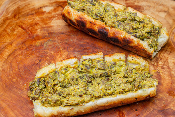 delicious garlic bread sandwich with meat and cheddar cheese, on the table made on the grill