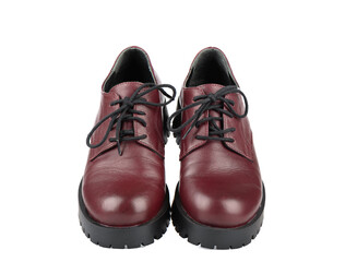 Women's brogue boots with tied laces on a white background.