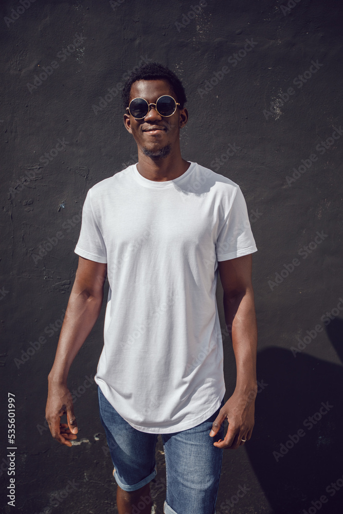 Wall mural African american man in white blank t-shirt. Mock-up.