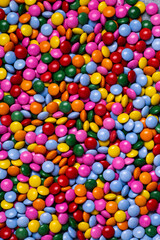 Candy coated chocolate button sprinkle texture
