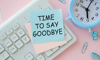 Notebook with phrase Time to say Goodbye and crumpled sheets of paper on pink background, flat lay