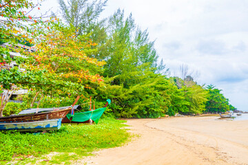 Naiyang Beach bay panorama with boats clear water Phuket Thailand.