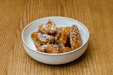 sesame fried wings in a plate