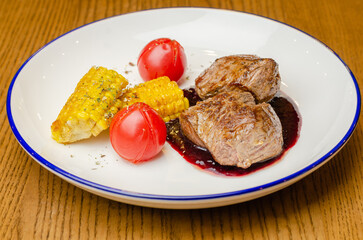 meat with sauce and vegetables