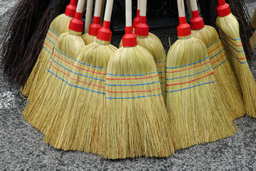 Raw handmade wooden brooms for cleaning made of sorghum