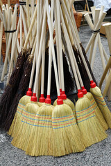 Old fashioned and antique wooden brooms for cleaning made of sorghum