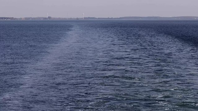 Langeland, Denmark The aft view of a ferry crossing between the Danish islands of Langeland and Lolland.