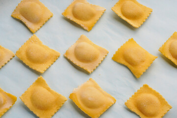 Italian pasta with filling on a blue background. Ingredients for dinner