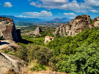 Fototapeta na wymiar Panoramic view of Meteora monastery on the high rock and road in the mountains , Greece