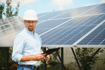 confident man and power solar station