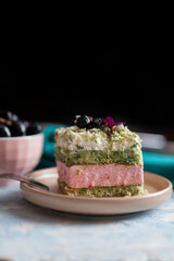 delicious sweet cake biscuit with pistachio cream with layers in a restaurant