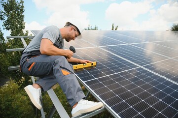 A man working at solar power station.