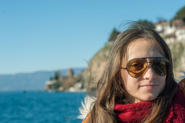 A young woman is enjoying her vacation at Ohrid lake