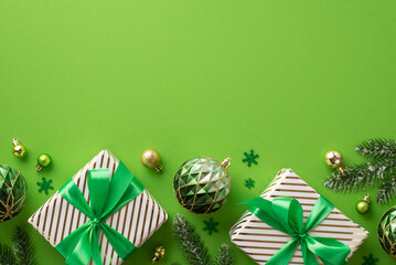New Year concept. Top view photo of stylish gift boxes with ribbon bows gold and green baubles...