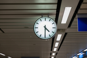 Clock at subway station. Large clock face public transport on a train station platform. Analog...