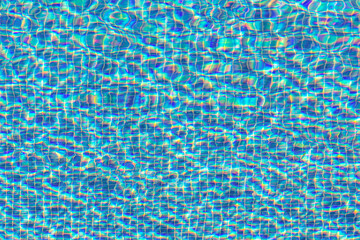 detail of blue pool water with light reflections and waves