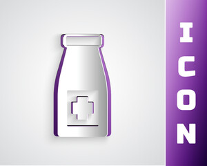 Paper cut Medicine bottle and pills icon isolated on grey background. Bottle pill sign. Pharmacy design. Paper art style. Vector