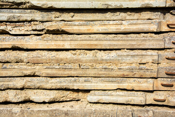 texture background of stack of old dismantled concrete road slabs