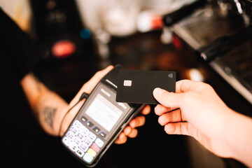 Customer making contactless payment using credit card
