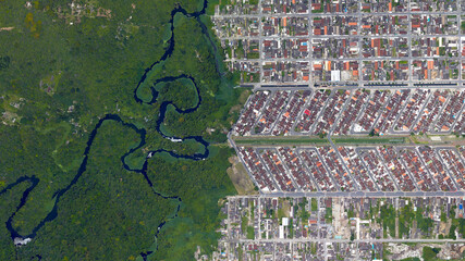 Forest, river and city border, forest and city separated by zigzag line, looking down aerial view...