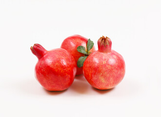 Red ripe pomegranate on a white background. Shallow depth of field