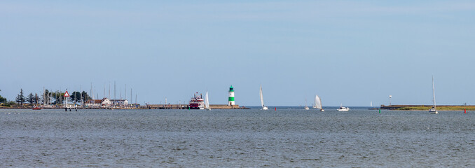 Lighthouse and boats at the Schlemmünde at the Geltinger Birk, Baltic Sea, Germany