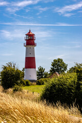 Lighthouse at Geltinger Birk, Baltic Sea, Germany. Bright blue sky.