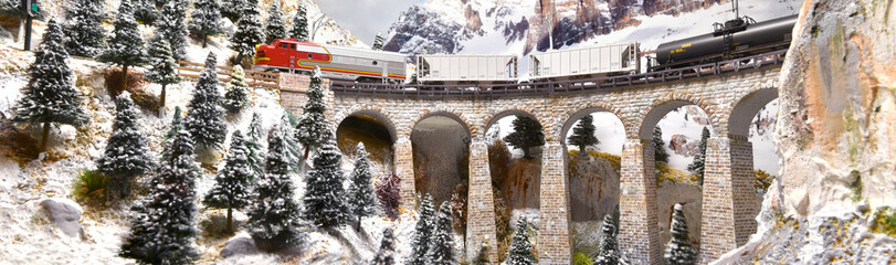 model train in miniature. Model railway. Miniature model of train on a mountains ambientation....